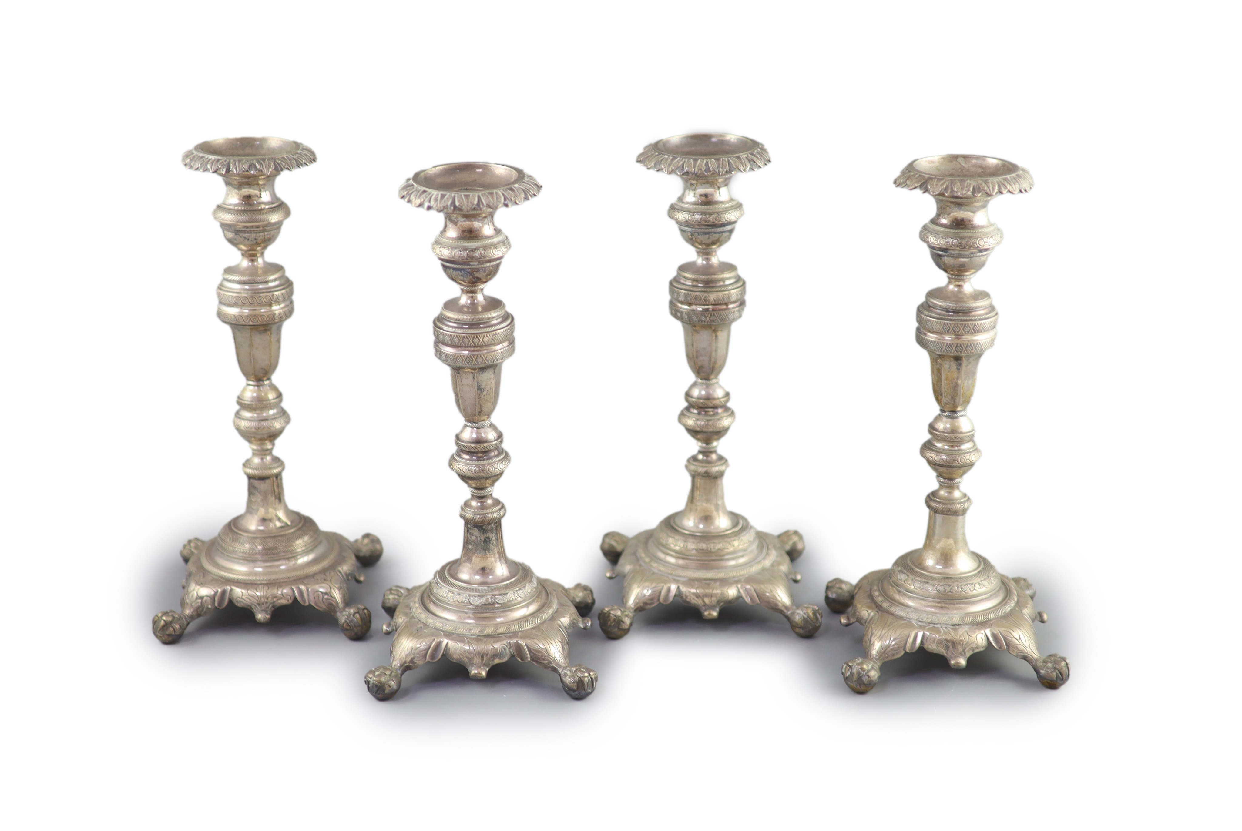 A set of four early 19th century South American? cast silver candlesticks